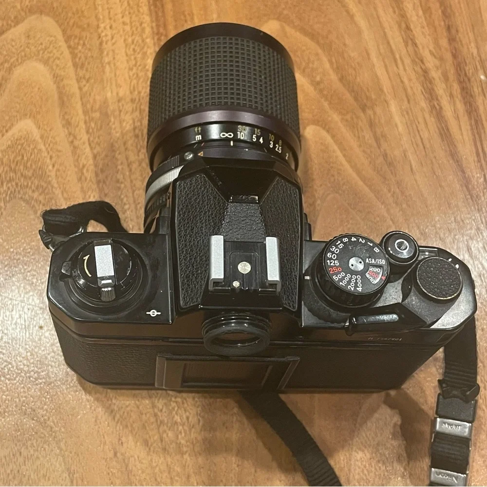 Vintage Nikon FM2 black camera with lens